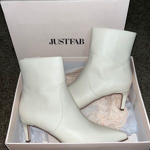 Never worn before off-white booties with a mini heal